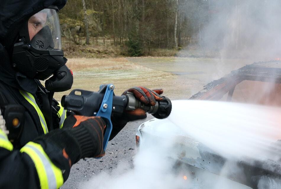 Cold Cut Cobra Multi-Purpose Nozzle (MPN) Shown sparying a vehicle fire