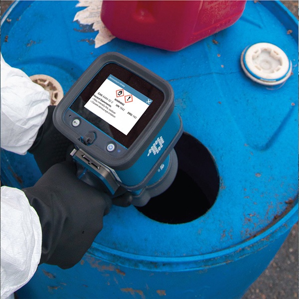 Pendar X10 Handheld Raman Spectrometer scanning the contents of an industrial container