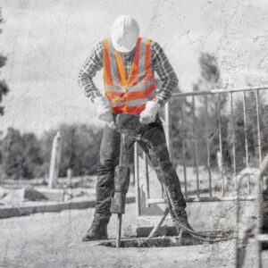 Construction worker wearing an occunomix hi-viz vest while working