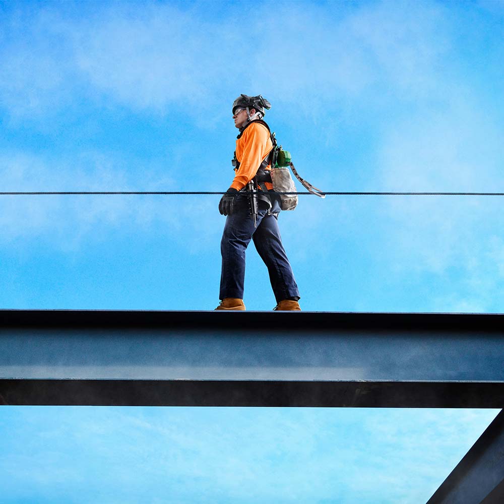 MSA Cable Temporary Horizontal Lifeline in use by construction worker walking along girder