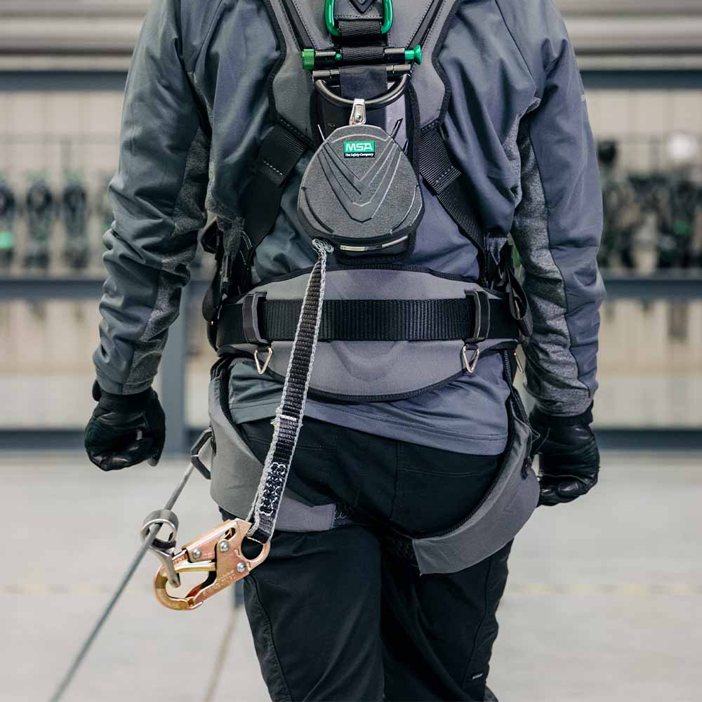 MSA Cable Temporary Horizontal Lifeline hooked up to harness worn by industrial worker